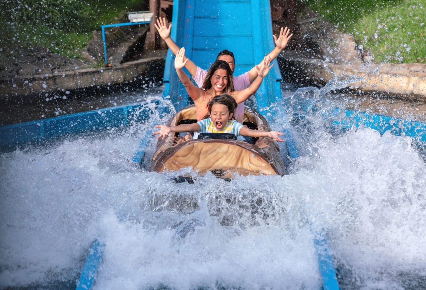 Happy family having fun in an amusement park